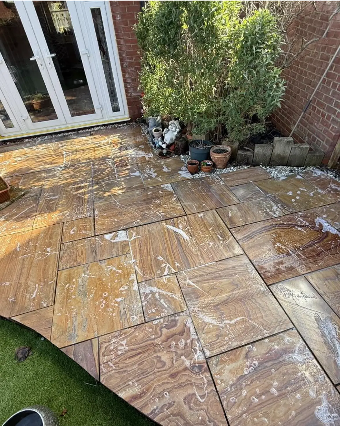 Patio cleaning by Geyserclean in Milton Keynes, work in progress