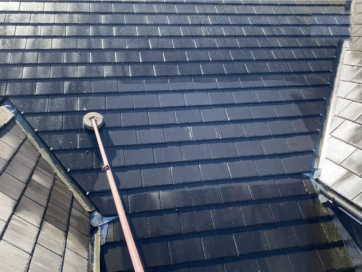 Roof cleaning by Geyserclean in Milton Keynes, work in progress